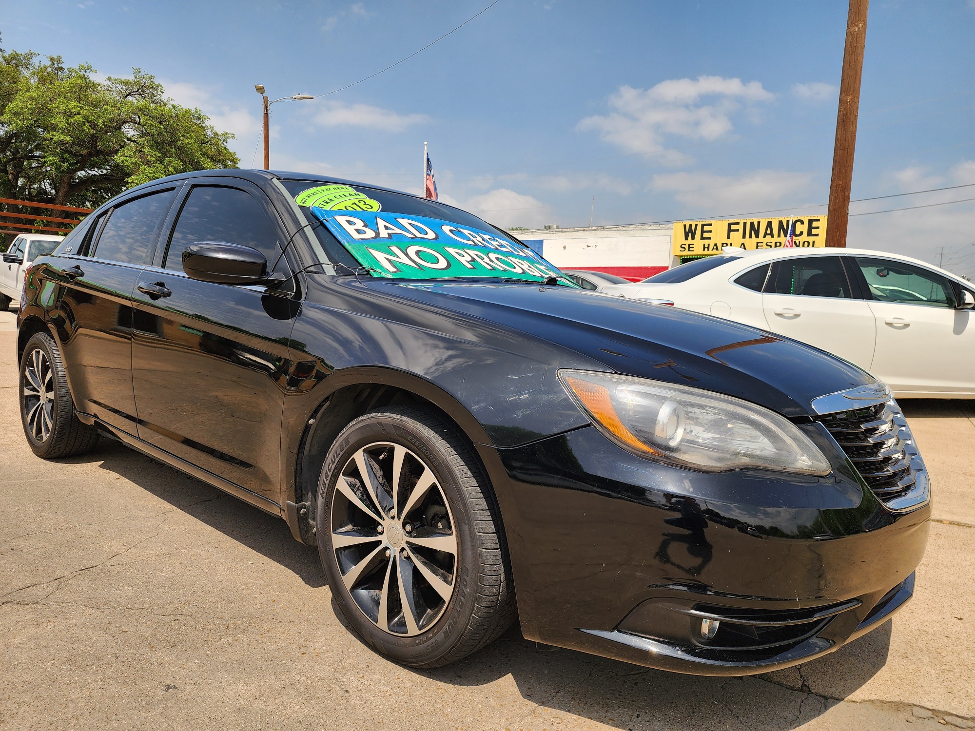 2013 BLACK Chrysler 200 Touring (1C3CCBBB2DN) with an 2.4L L4 DOHC 16V engine, 6-Speed Automatic transmission, located at 2660 S.Garland Avenue, Garland, TX, 75041, (469) 298-3118, 32.885551, -96.655602 - Welcome to DallasAutos4Less, one of the Premier BUY HERE PAY HERE Dealers in the North Dallas Area. We specialize in financing to people with NO CREDIT or BAD CREDIT. We need proof of income, proof of residence, and a ID. Come buy your new car from us today!! This is a very well cared for 2013 Ch - Photo #1